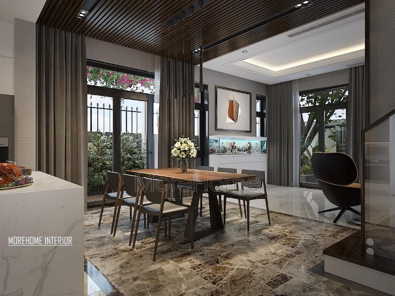 Thiết kế phòng ăn hiện đại thông thoáng, chan hòa với thiên nhiên từ hệ cửa lớn giúp ánh sáng lan tỏa tối đa nhưng vẫn chắn nắng kịp thời từ rèm 2 lớp. Thiết kế nội thất phòng ăn biệt thự
