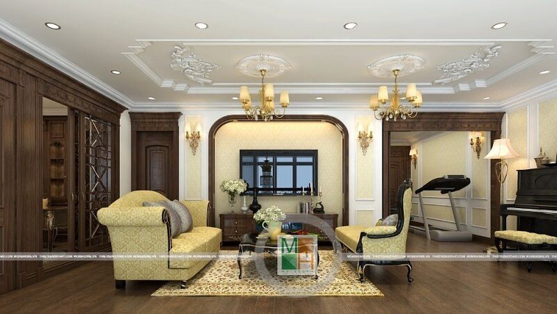 Thiết kế nội thất chung cư Mandarin tân cổ điển đẹp với tông màu vàng ánh kim chủ đạo trên nền sàn ốp gỗ màu nâu trầm làm nổi bật không gian căn phòng.