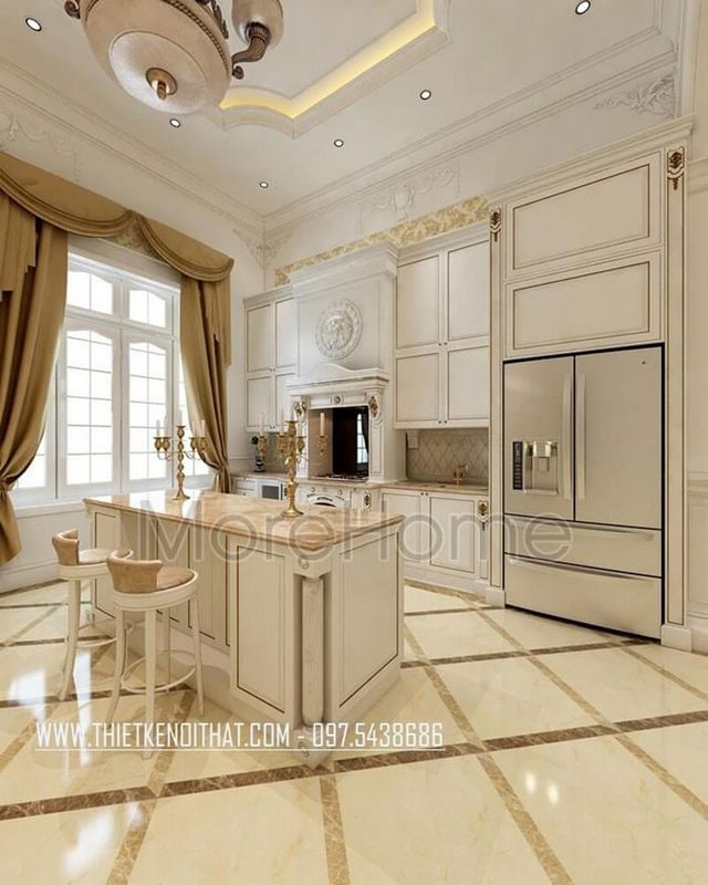 Mẫu tủ bếp gỗ tân cổ điển màu trắng cùng với thiết bị bếp hiện đại, sang trọng cho phòng bếp